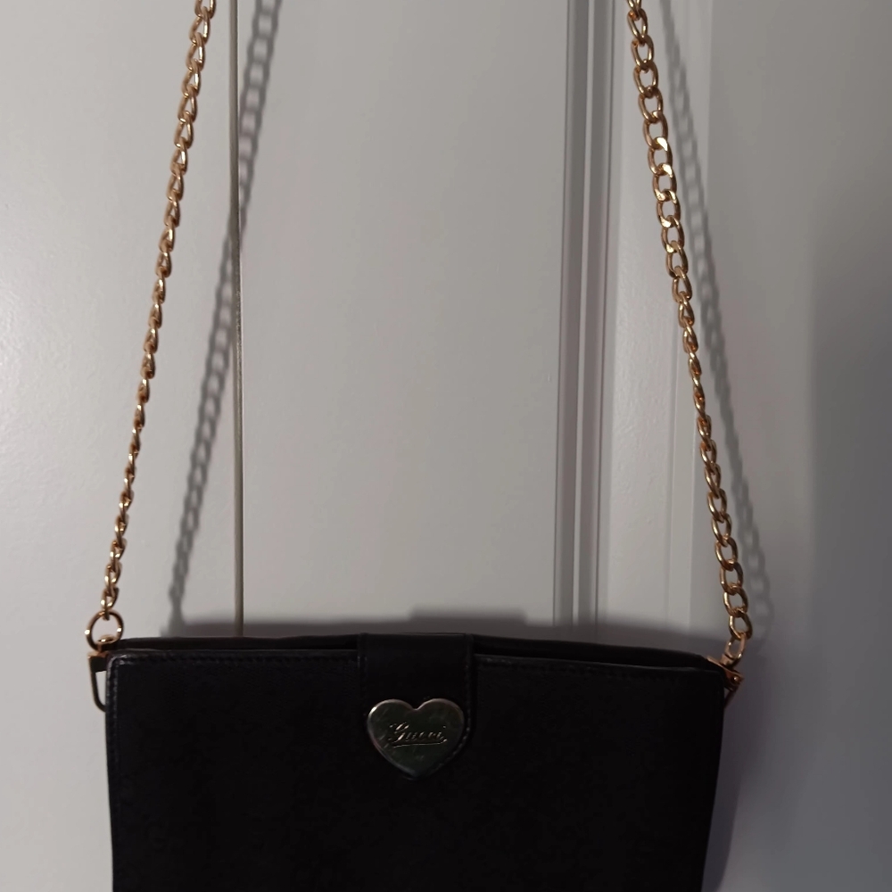 Chic Black and Gold Crossbody Bag with Chain Strap